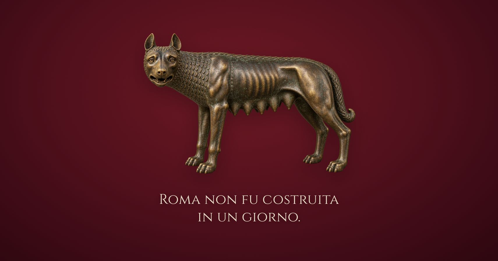 A bronze Roman wolf on deep red, above the words Roma non fu costruita in un giorno